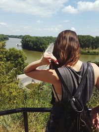 Rear view of woman standing at observation point