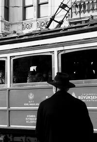 Rear view of man on bus