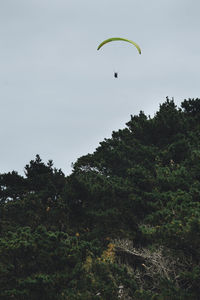 Low angle view of kite flying against sky