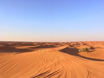 Scenic view of desert against clear sky