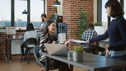 Business colleagues working on table