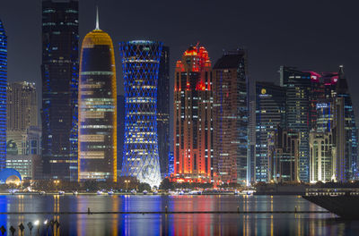 Downtown cityscape at night. illuminated city at waterfront. doha
