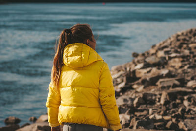 Rear view of woman looking at sea