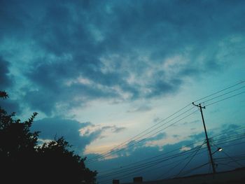 Low angle view of silhouette tree against sky