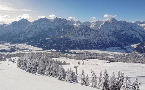 Scenic view of snowcapped mountains against sky