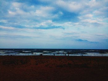 Scenic view of sea against cloudy sky