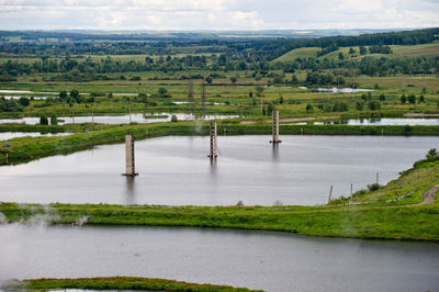 Scenic view of landscape with river in background