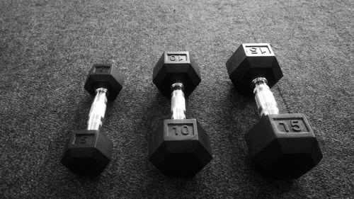 High angle view of dumbbells on floor