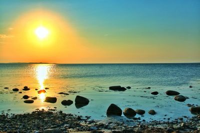 Scenic view of sea at sunset