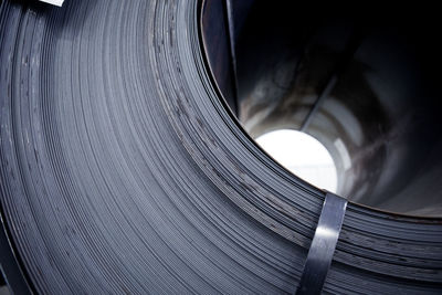 Extreme close-up of rolled up sheet metals at warehouse