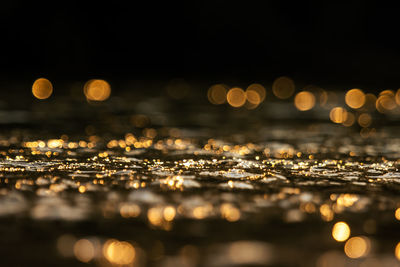 Bokeh from sunlight that hits the water surface