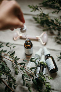 High angle view of person in bottle on table