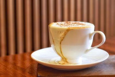 Close-up of coffee cup on table