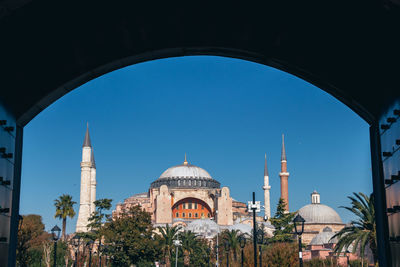 Panoramic view of historic building against clear blue sky