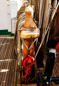 Close-up of ship hanging on boat