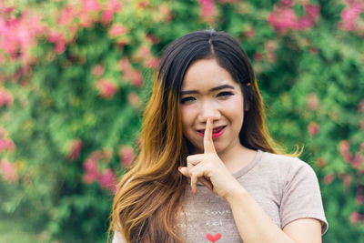 Portrait of young woman in park