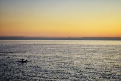 Scenic view of sea against sky at sunset