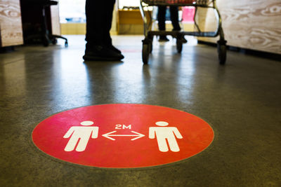 High angle view of information sign on floor