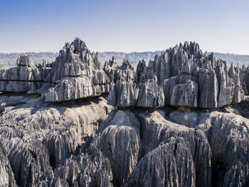 Panoramic view of rocks on landscape against clear sky