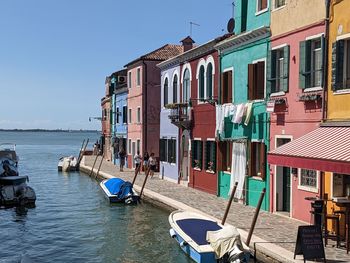 Boats in sea against clear sky