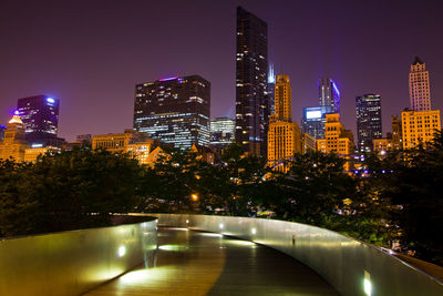 Illuminated buildings in city at night