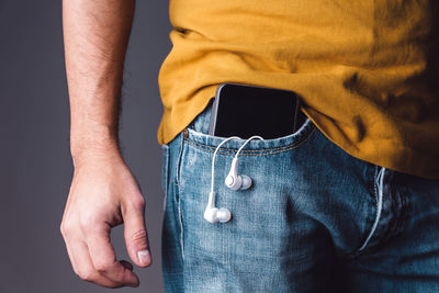 Midsection of man wearing mask