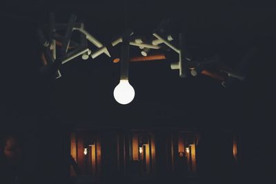 Illuminated lamp post at night