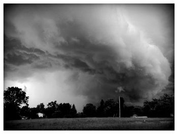 Scenic view of landscape against cloudy sky