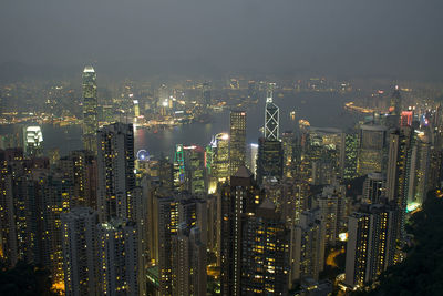 Aerial view of city lit up at night