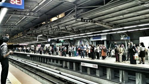 People at railroad station platform