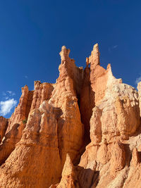 Low angle view of rock formations against clear blue sky at bryce canyon national park in utah