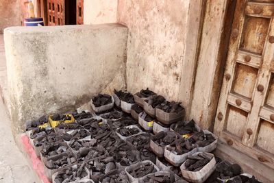 Stack of logs against wall