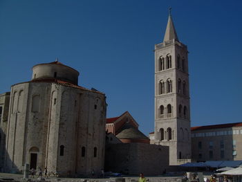 Low angle view of church against blue sky