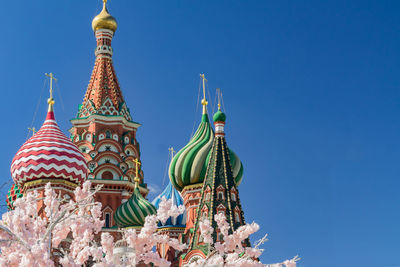 Low angle view of traditional building against clear blue sky