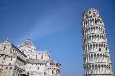 Low angle view of historic building against clear blue sky