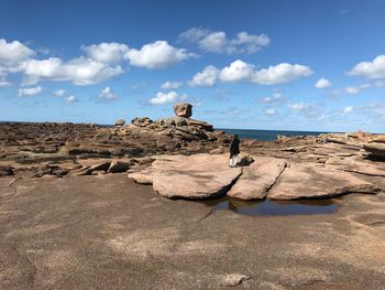 Rock formations on land against sky