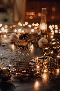 Close-up of illuminated christmas lights on table