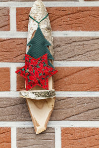 High angle view of christmas decoration on wooden wall