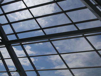 Low angle view of sky seen through glass window