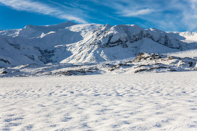 Scenic view of snowcapped mountains against sky