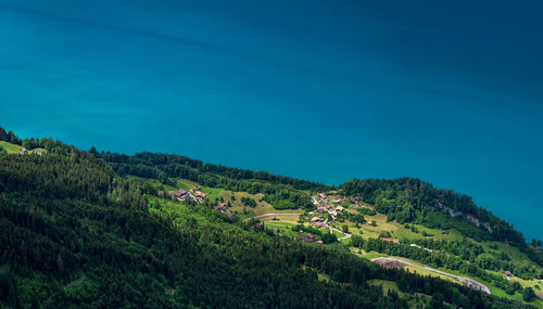 Scenic view of landscape against blue sky