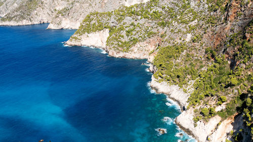 High angle view of rocks by sea