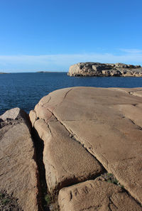 Scenic view of beach against blue sky