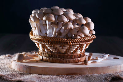 Close-up of cake on table against black background