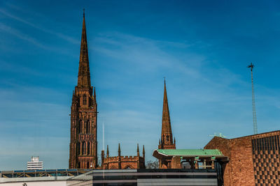 Buildings in city against sky