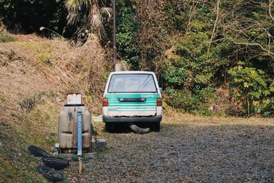 Abandoned car on field