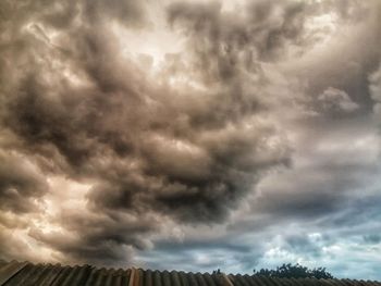 Low angle view of storm clouds over dramatic sky