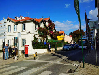 City street and buildings against sky