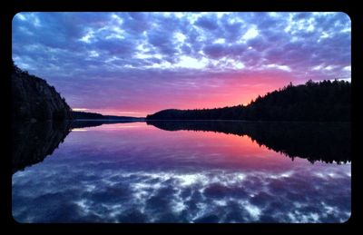 Reflection of clouds in calm lake