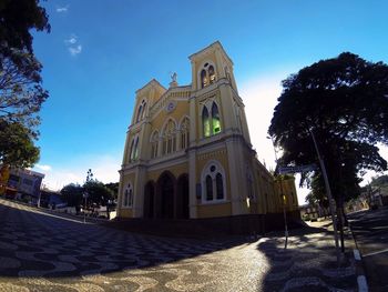 Low angle view of church against blue sky